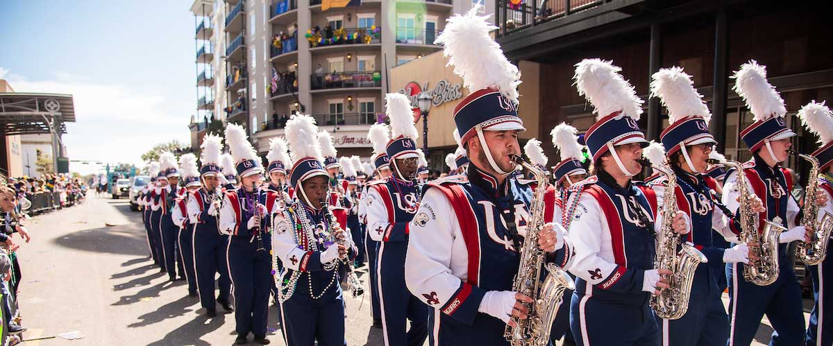 Jaguar Marching Band marching at Mardi Gras.
