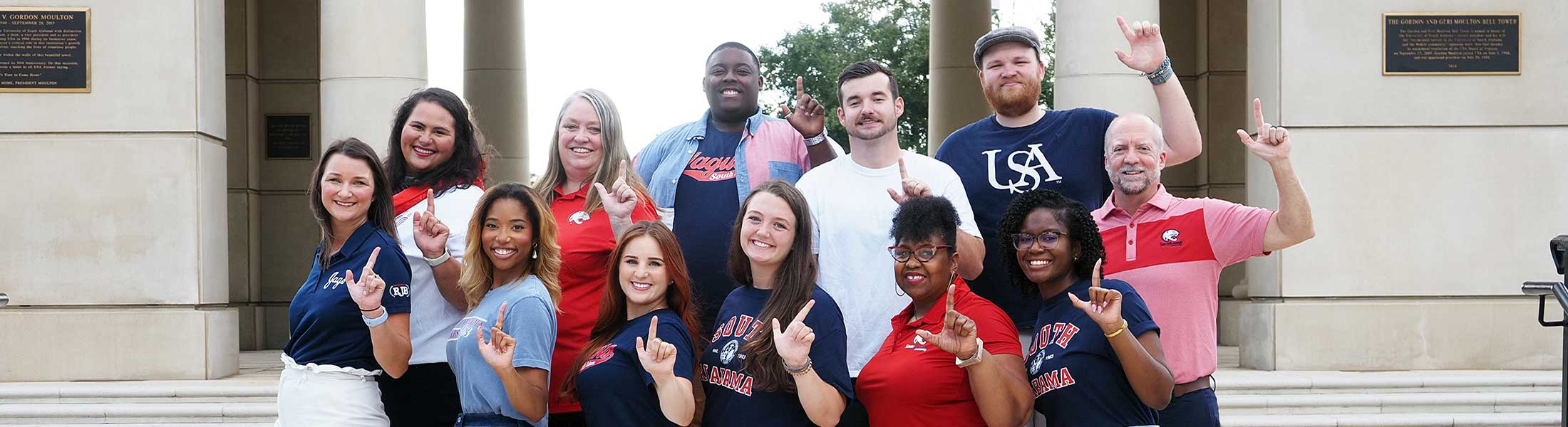 Recruitment Team holding J sign for Jaguars.