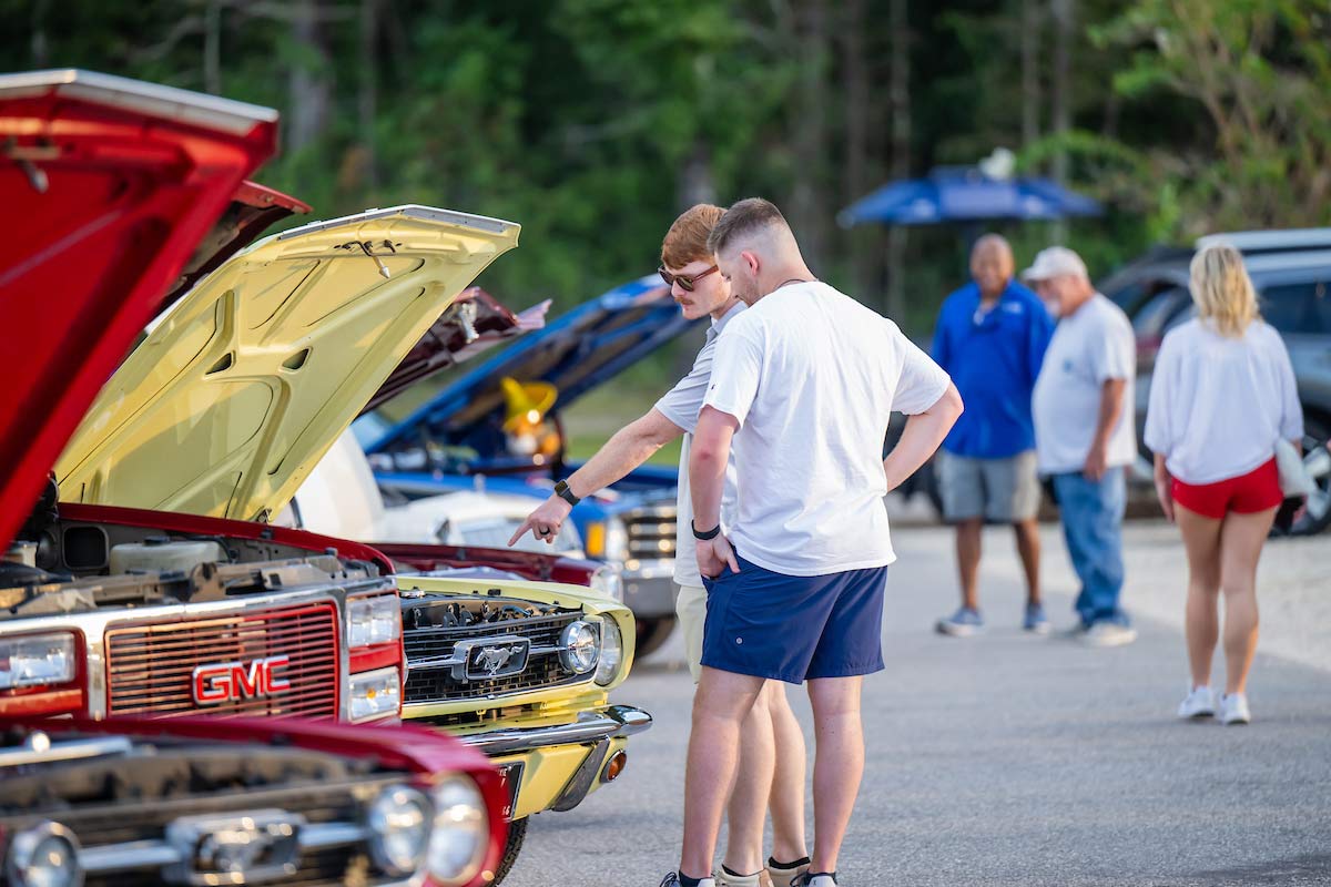 Students viewing antique cars Students viewing antique cars